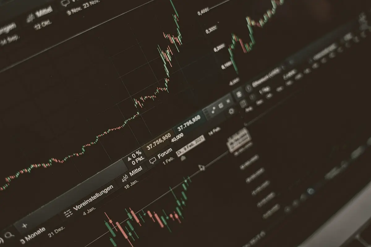 A candlestick price chart and order-book panel on a dark trading screen.